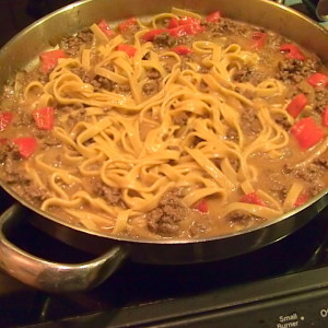 fettuccine with cheesy meat sauce